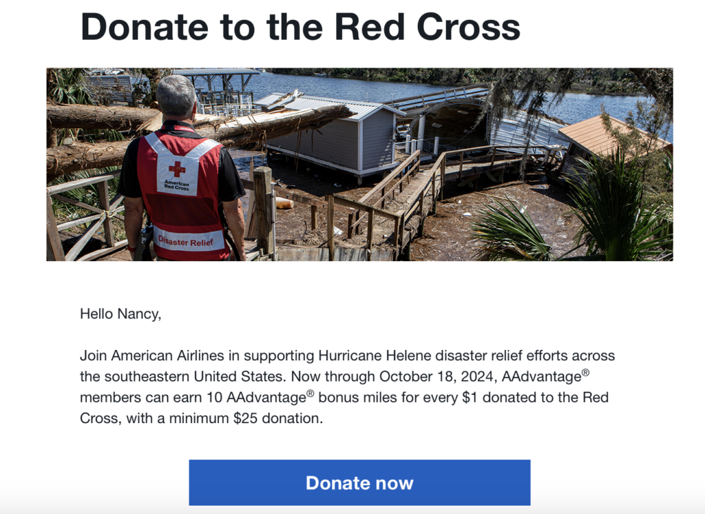 a man in a red cross vest looking at a house